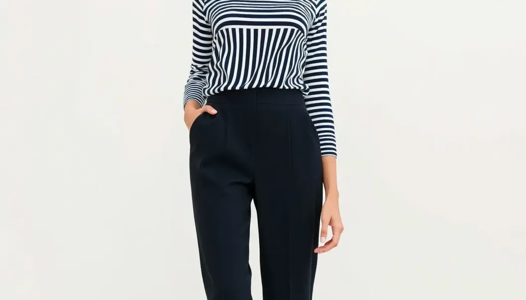 A petite woman stylistically dressed to look taller.
